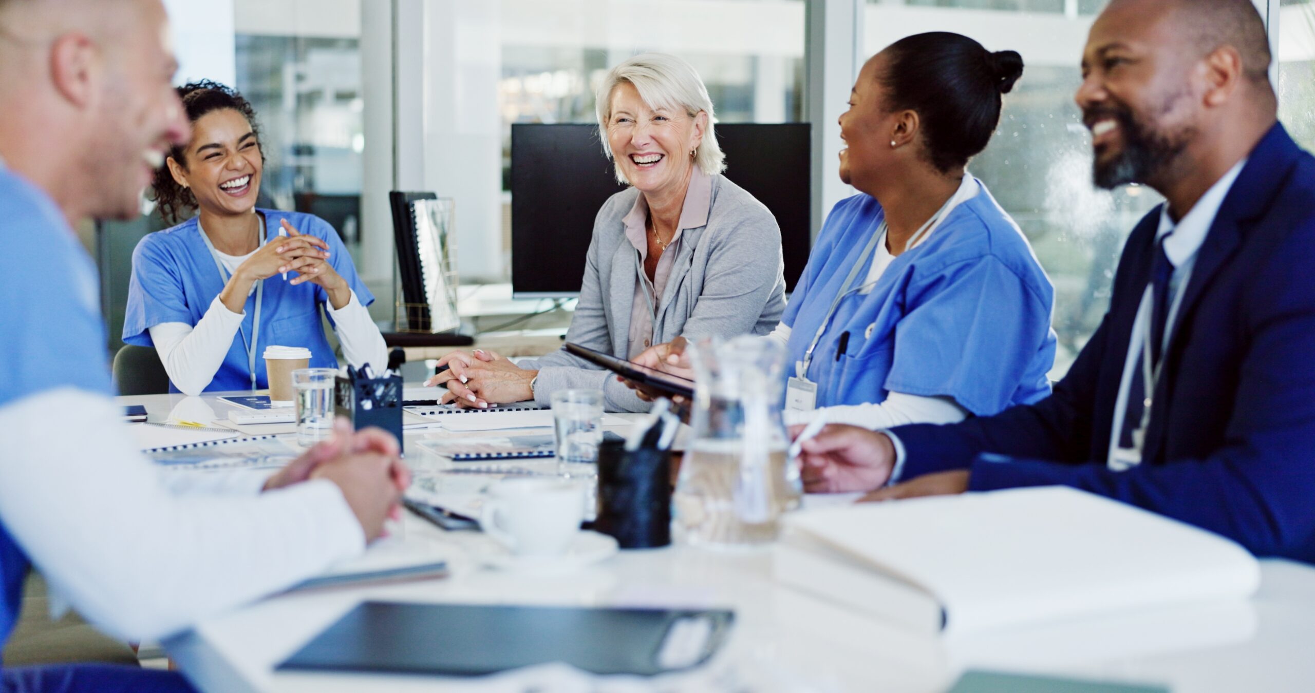 Boardroom,,Collaboration,And,Healthcare,With,Hospital,Manager,Speaking,To,Staff About